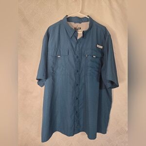a Habit short-sleeve river shirt in Teal blue polyester fabric.